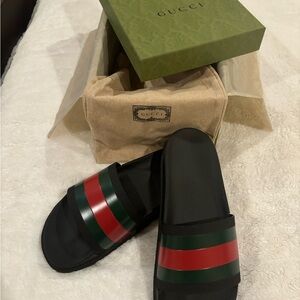 Gucci Pool Slides. Size 10. Practically new. Barely used and in excellent shape